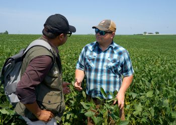 Author in conversation with young farmer Riley Schnell in Sully, Iowa.