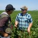 Author in conversation with young farmer Riley Schnell in Sully, Iowa.